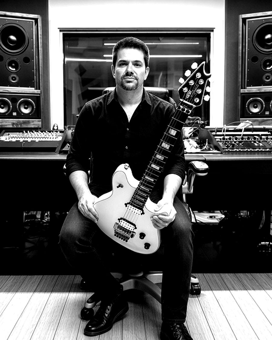 Chad Kulengosky with his guitar at the studio in Rancho Santa Margarita